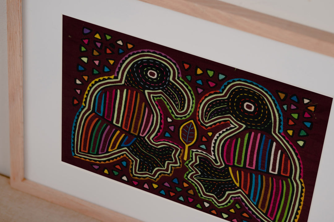 Burgundy Bird Playing Footsie Mola