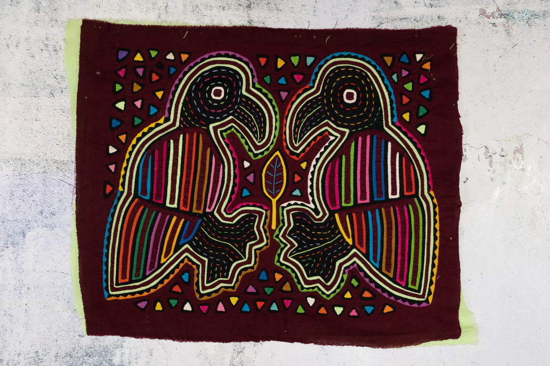 Burgundy Bird Playing Footsie Mola