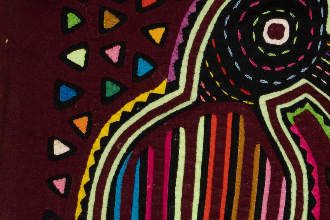 Burgundy Bird Playing Footsie Mola