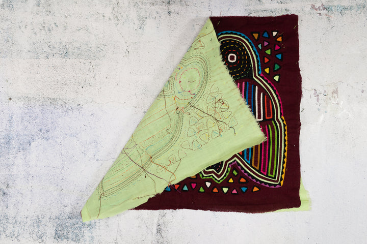 Burgundy Bird Playing Footsie Mola