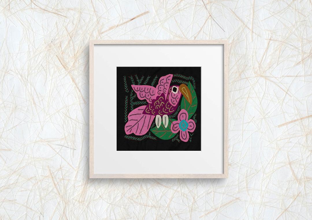 Panama molita, a pink volcano hummingbird by a blue flower on black, hand stitched reverse applique