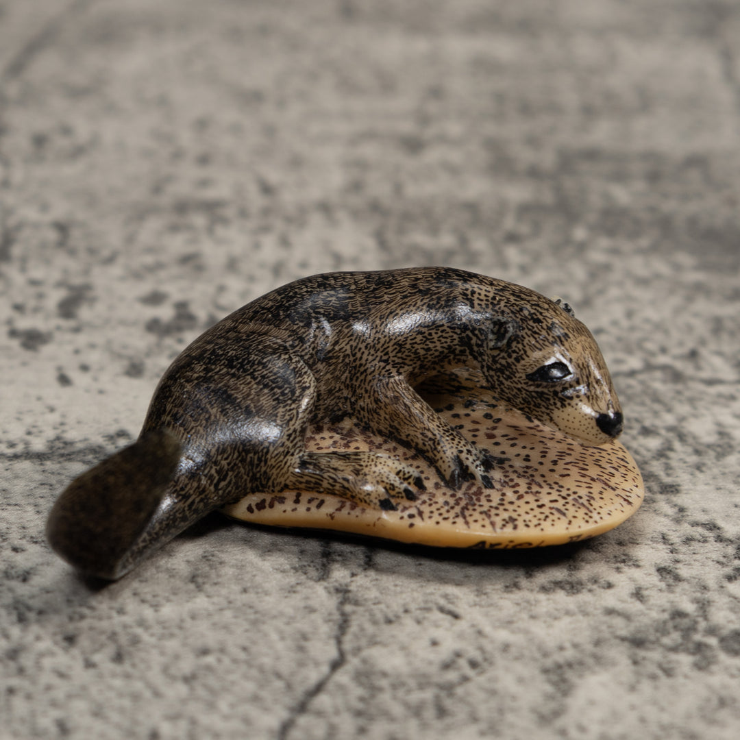 Black And Speckled River Otter Tagua Carving