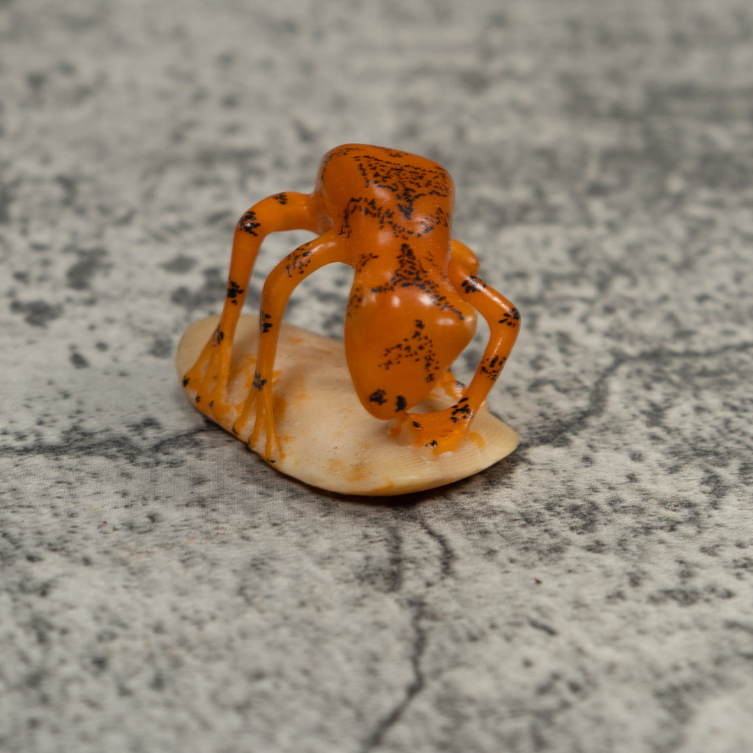 Orange And Black Undercut Frog Tagua Carving