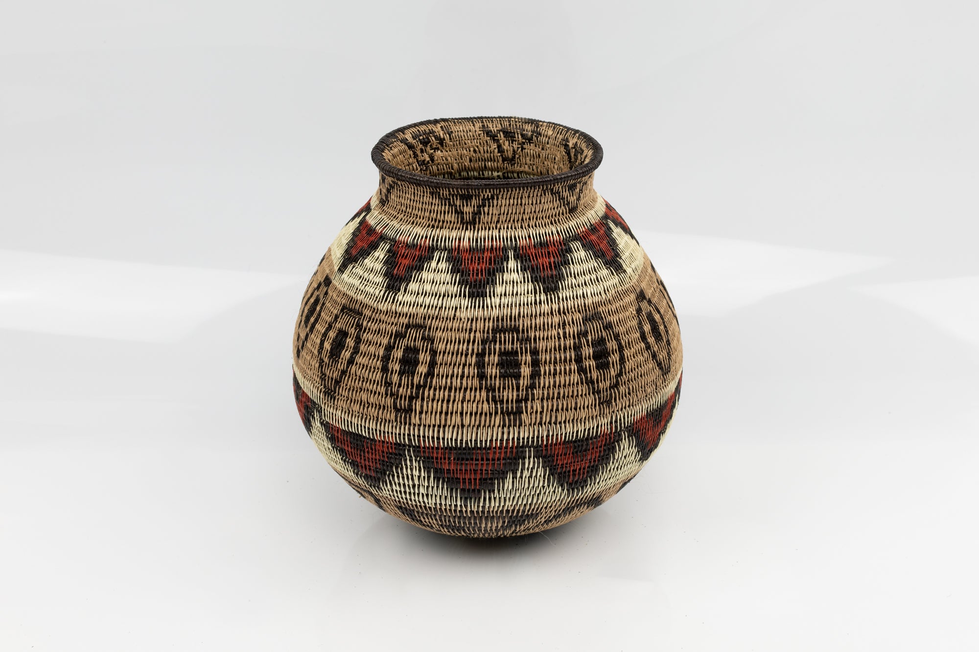 Panama Indian feather Wounaan basket. brown, red, White. Hand woven.