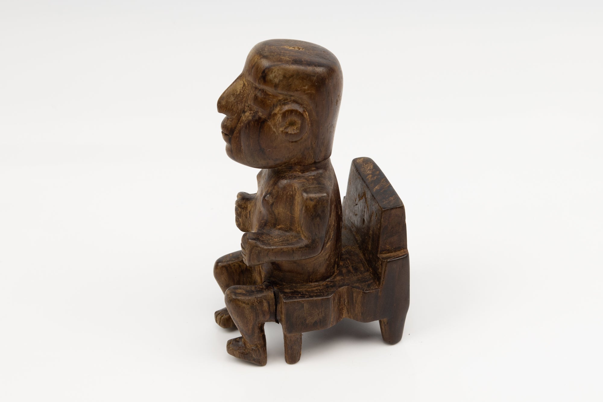 Hand Carved Cocobolo Wood Figure in Chair Sculpture