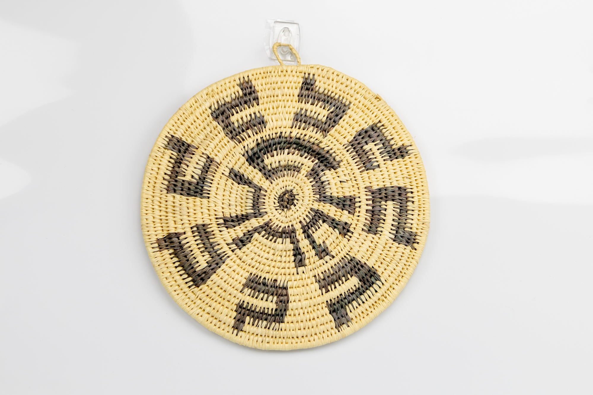 Hand woven plate basket from Panama. gray and white colors. Wall decoration. Indigenous artists Panama.