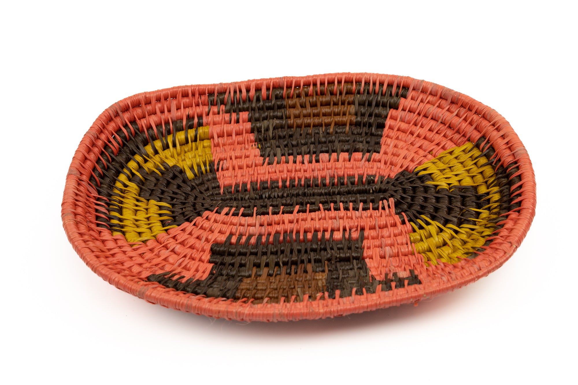 Hand woven plate basket from Panama. Pink, gold, black colors. Wall decoration. Indigenous artists Panama.