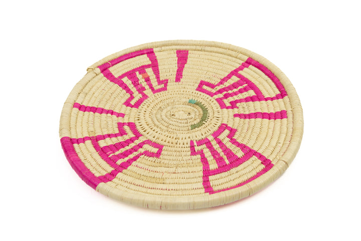 Hand woven plate basket from Panama. Pink and white colors. Wall decoration. Indigenous artists Panama.