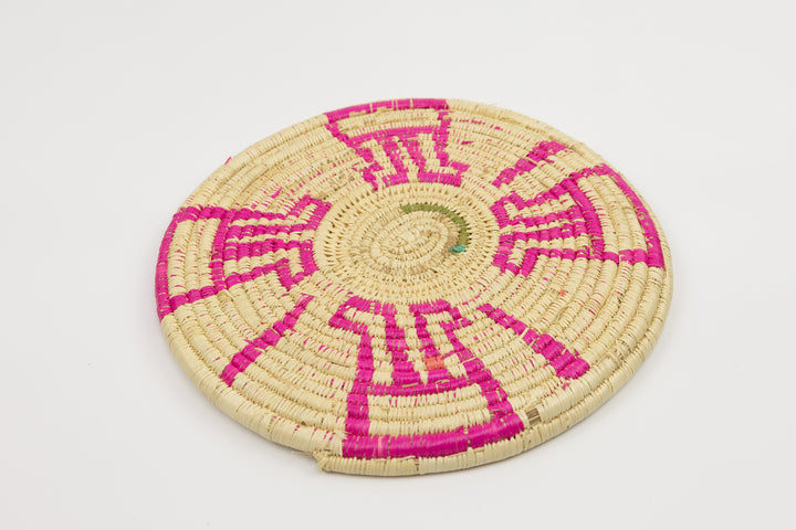Hand woven plate basket from Panama. Pink and white colors. Wall decoration. Indigenous artists Panama.