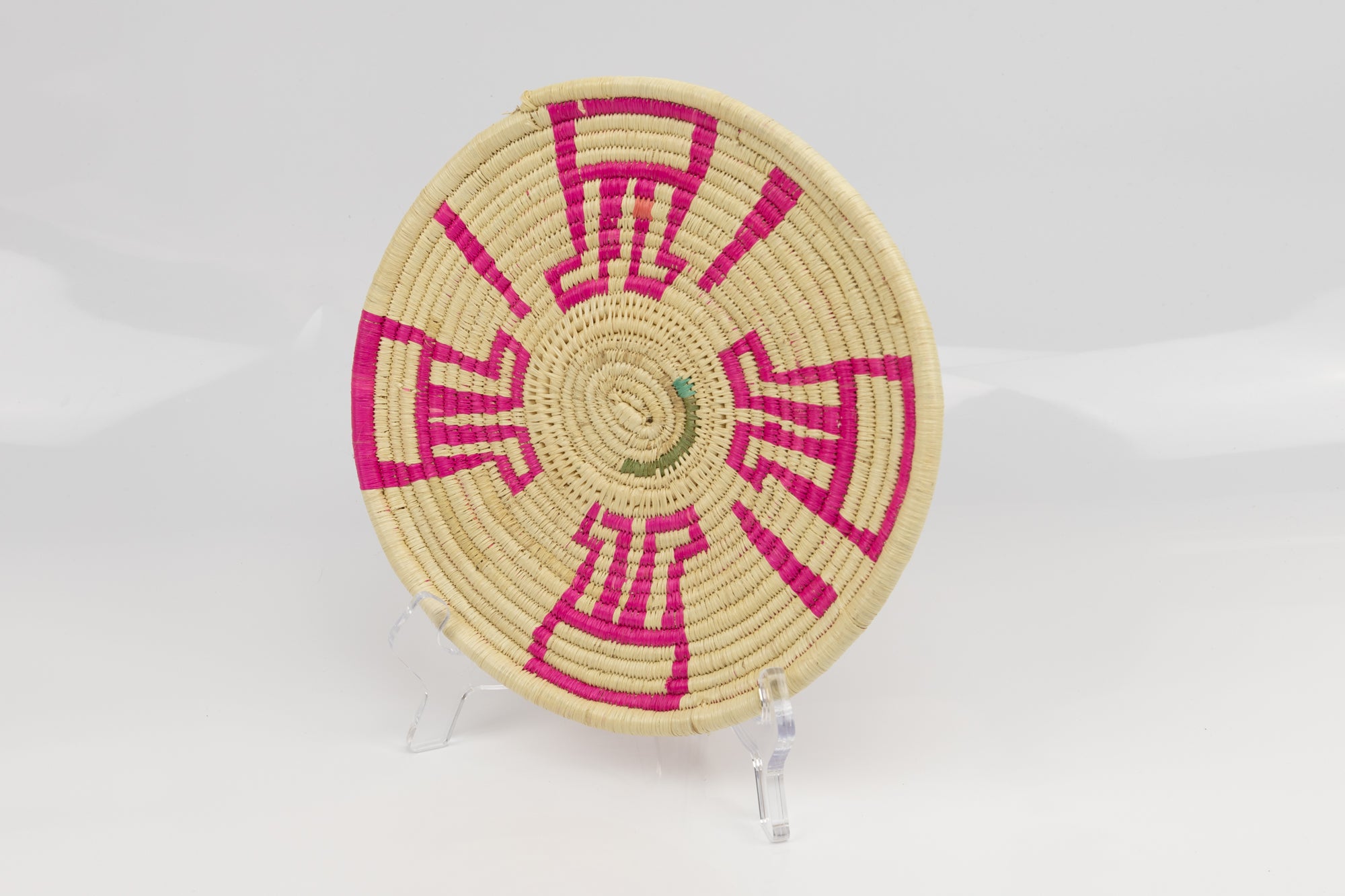Hand woven plate basket from Panama.  Pink and white colors. Indigenous artists. 