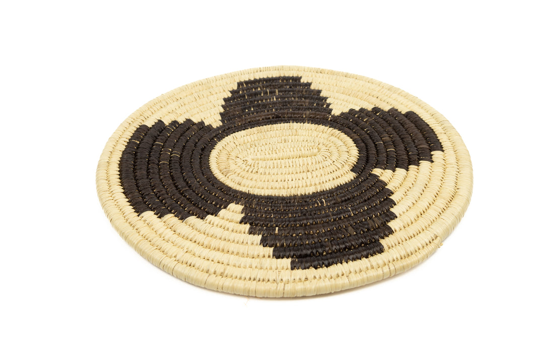 Hand woven plate basket. Black and white colors. 10" diameter and slightly oval in design. 