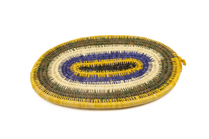 Purple, gold, brown and white. Hand woven plate basket for the wall. Natural dyes. palm fiber. Made in Panama. 
