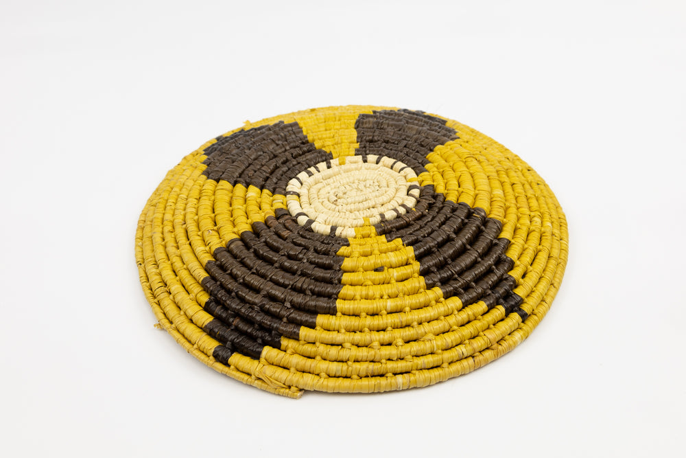 Gold, brown and white. Hand woven plate basket from Panama. Sambu village near Colombia.