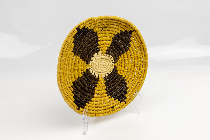 Gold, brown and white. Hand woven plate basket from Panama. Sambu village near Colombia.