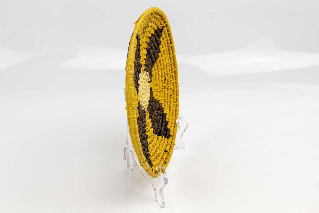 Gold, brown and white. Hand woven plate basket from Panama. Sambu village near Colombia.