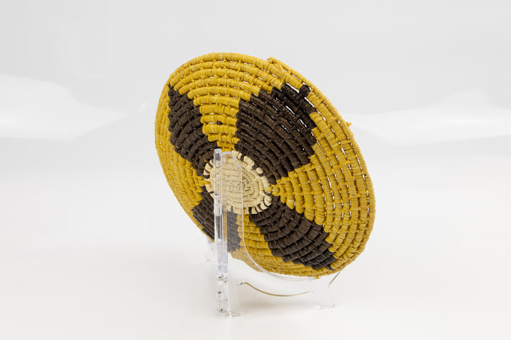 Gold, brown and white. Hand woven plate basket from Panama. Sambu village near Colombia.